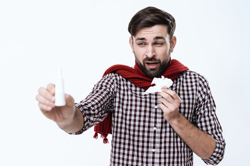 Man stands with a napkin in hand and feels a cold.