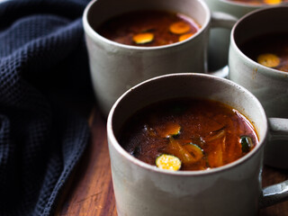 Gut healing bone broth with paprika and zucchini slices.