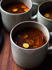 Gut healing bone broth with paprika and zucchini slices.
