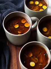Gut healing bone broth with paprika and zucchini slices.