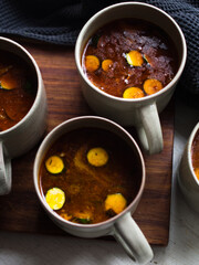 Gut healing bone broth with paprika and zucchini slices.