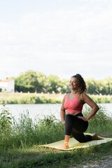 Fototapeta na wymiar girl or woman doing sports outdoors near a river, nature