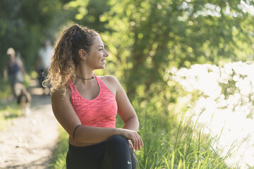 girl or woman doing sports outdoors near a river, nature