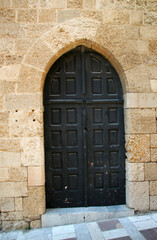Fototapeta na wymiar Arch door, Avenue of the Knights, the Old Town of Rhodes, Greece