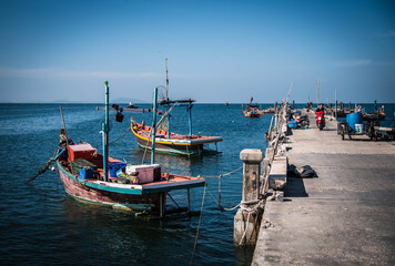 Fototapeta na wymiar Local fishing boats dock at Saphan Pla Pier, Hat Won, Bang Saen District, Chonburi Province
