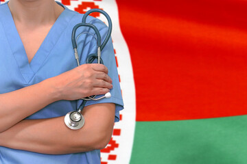 Female surgeon or doctor with stethoscope in hand on the background of the Belarus flag. Surgery...