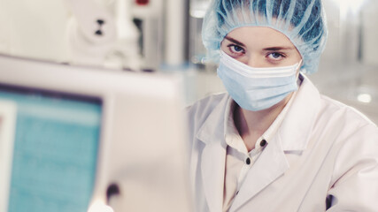 Female scientist testing biohazardous samples, Futuristic laboratory interior