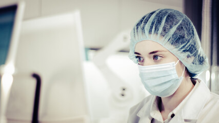 Female scientist testing biohazardous samples, Futuristic laboratory interior