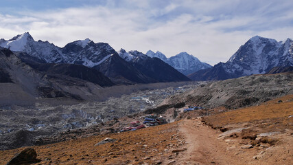Beautiful panorama view of Khumbu glacier and Sherpa village Gorakshep, the last stop before Mount Everest, with snow-capped majestic mountains viewed from Kala Patthar, Himalayas, Nepal.