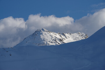 Fototapeta na wymiar Snowcapped mountains against sky