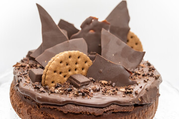 Delicious chocolate cake decorate with biscuits and chocolate