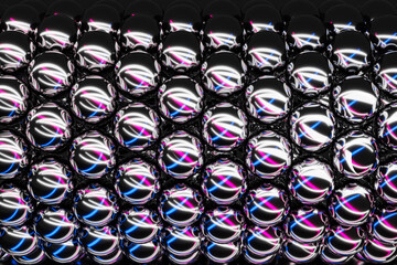 Fototapeta premium 3D illustration steel bearings lined up under blue, pink and white light. Steel Ball Bearings shined and lined up