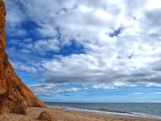 Fototapeta na wymiar Beautiful Algarve beach with red cliffs, Olhos de Agua, Albufeira