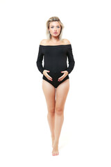 pregnant woman in black bodysuit on white background full length