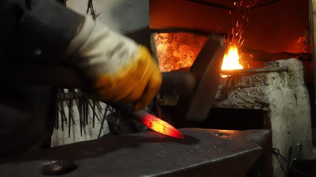 hot forging machine, blacksmith working in the workshop