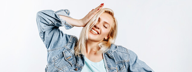 Beautiful happy young girl on gray isolated background