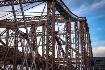 Fototapeta na wymiar An old, rusty steel bridge