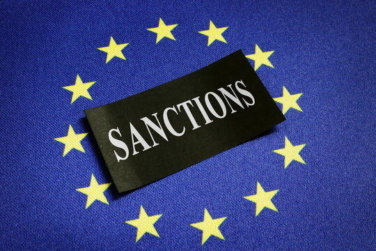 Europe Union EU Flag And Word Sanctions On It.