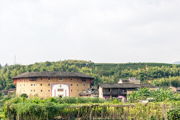 Fototapeta na wymiar aerial view of Tianluokeng Tulou cluster with mist,located in Fujian,China