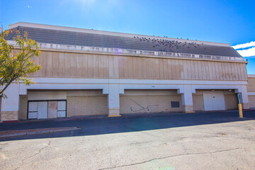 Abandoned Big Box Commercial Store With Boarded Up Entrance