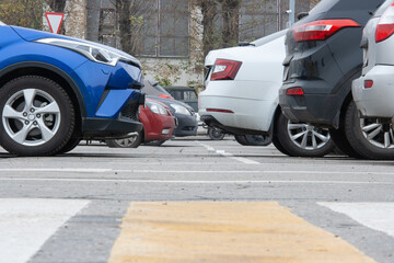 Cars of different colors in the parking lot