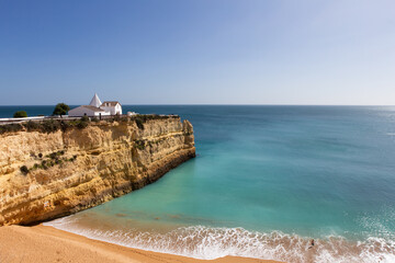 White chapel on the cliff overlooking the ocean