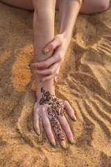 hands on the sand