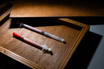 Vaccine ampoule isolated in a box set for injection mixed,Corona virus treatment concept,Covid-19.