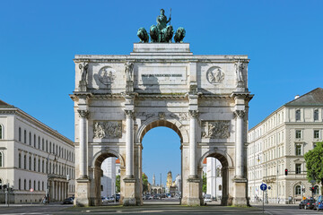 Fototapeta na wymiar Siegestor - the triumphal arch in Munich, Germany. It was commissioned by King Ludwig I of Bavaria and completed in 1852. Dedication on the frieze means 