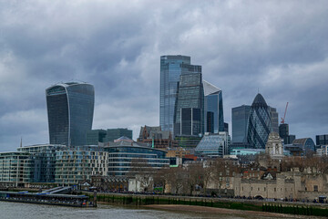 Fototapeta na wymiar From the London Bridge view of the impressive skyscrapers of the city. Photograph taken in London, England, United Kingdom.