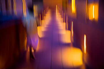 Motion blur of colorful pathway at a hotel lit up at dusk