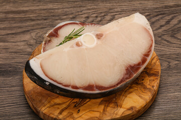 Raw shark steak served rosemary
