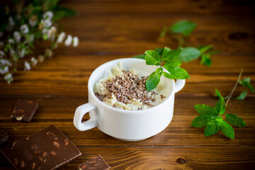 sweet noodles with milk and grated chocolate in a bowl