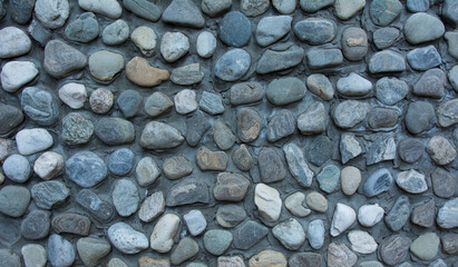 texture of a wall from round sea stones.