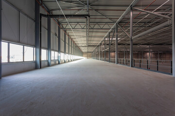 View inside a new empty warehouse on the mezzanine floor looking into the hall - obrazy, fototapety, plakaty