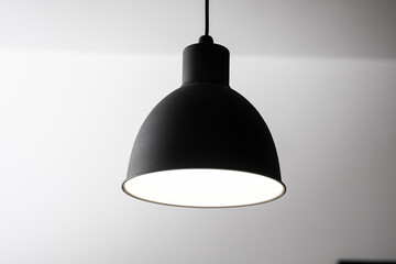 Industrial black look pendant lamps in a kitchen interior. Modern loft interior design.