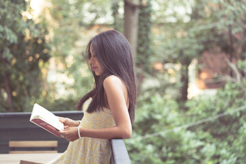 girl reading outdoors