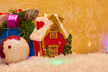 Christmas house in the snow,statuette of a Christmas house in the snow with balls