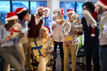 Group of cheerful personnel posing for a photo at New Year eve company party. New Year, holiday, party, people concept