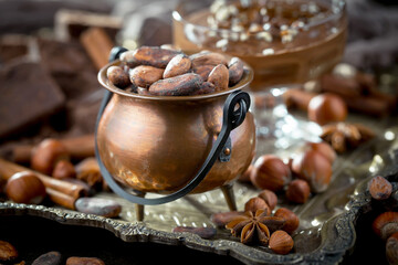 Cocoa beans on an old background.