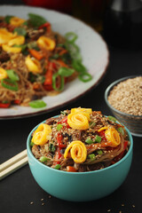 Japchae, a sweet and savory dish of stir-fried glass noodles, Korean cuisine