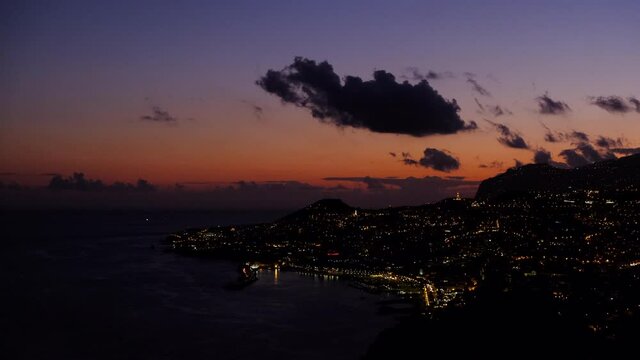 Sunset over the city of Funchal on Madeira island during a beautiful summer evening.