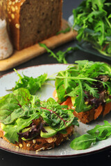 Sandwiches with salmon, avocado and salad