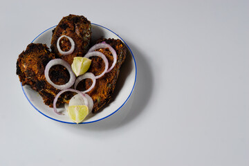 Sea food Spicy fish fry on a white plate