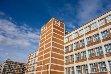 The building of Batuv Institut and museum in Zlin with red bricks and the blue sky