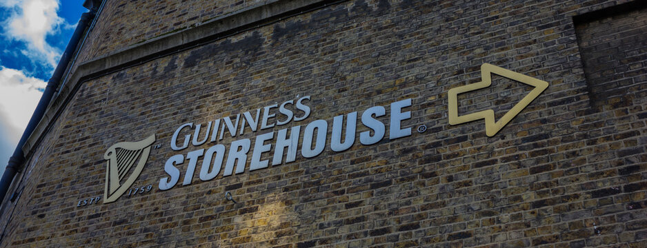 Dublin, Ireland- October 7, 2014: A picture of the Guinness Storehouse sign on display in a bricked building.