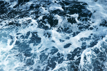 Fototapeta na wymiar Kind of seawater with waves, foam and splashes..