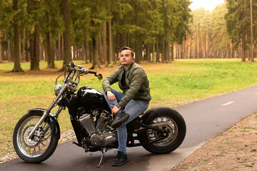 Fototapeta na wymiar Beautiful young man, road, motorcycle