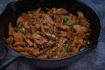 Fried jackfruit as pulled meat vegan in cast iron pan