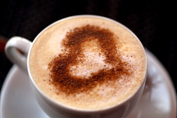 Photo of delicious coffee with a heart pattern cappuccino
